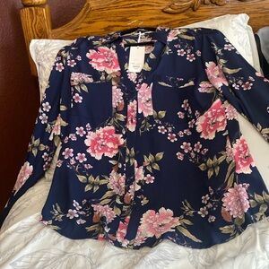 Light long sleeved or 3/4 length sleeved button -down blouse